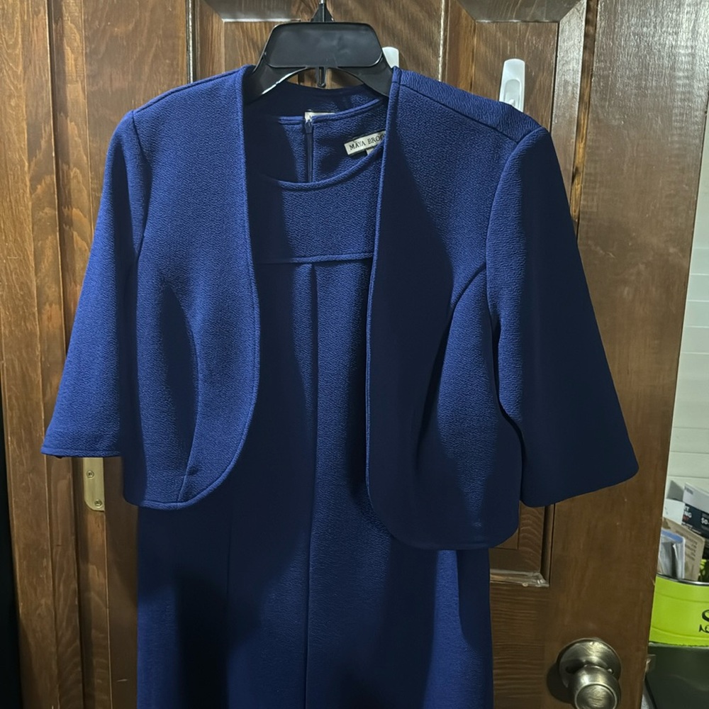 Beautiful blue sleeveless dress with mid-length jacket.